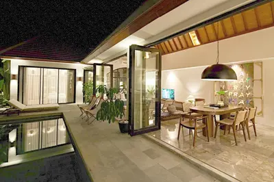 a dining room and living room with a dining table at MASARA Villa - 5Min to Canggu - 2Min to Shops & Restaurants in Canggu