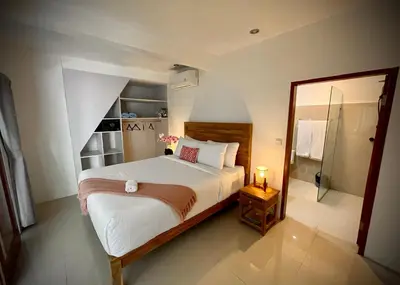 a bedroom with a bed and a walk in shower at Villa Majegau 1 Seminyak in Seminyak