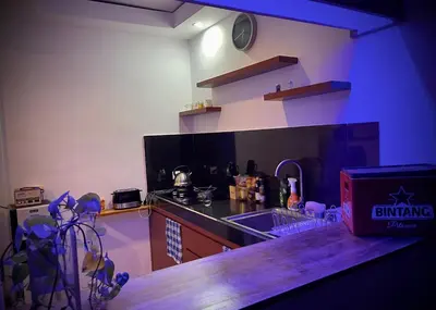 a kitchen with a sink and a counter top at Villa Majegau 1 Seminyak in Seminyak
