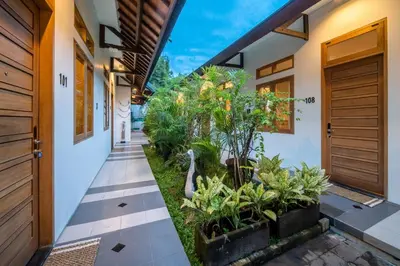 an internal courtyard of a house with plants at Little Boutique Hotel 108- 30m from beach in Canggu