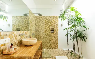 a bathroom with a bowl sink and a plant at Villa Gallici Seminyak in Seminyak