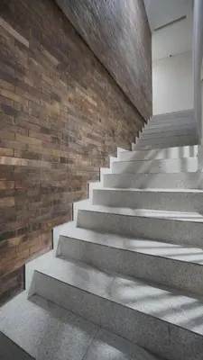 a staircase in a building with a brick wall at Maharani Residence in Denpasar