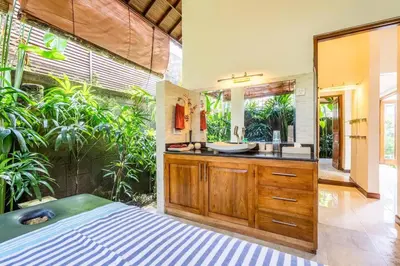 a bathroom with a sink and a mirror at Taman Rahasia by iBali Management in Kerobokan