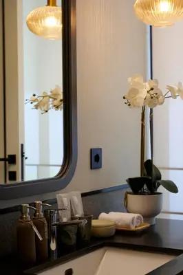 a bathroom counter with a sink and a mirror at Adamare Villa Umalas in Kerobokan