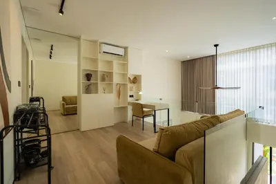 a living room with a couch and a table at Oasis Villa 8 by Betterplace in Canggu