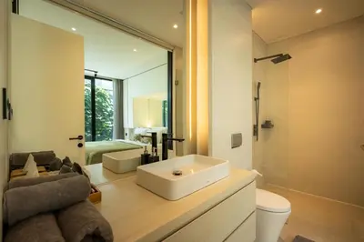 a bathroom with a sink and a toilet and a mirror at Oasis Villa 8 by Betterplace in Canggu