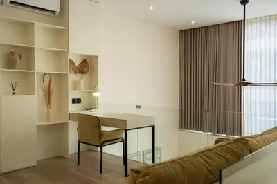 a living room with a table and a couch at Oasis Villa 8 by Betterplace in Canggu
