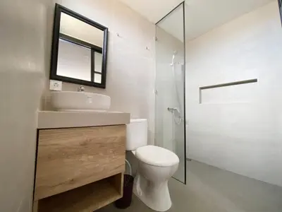 a bathroom with a toilet and a sink and a shower at PAMELA BALI in Kerobokan