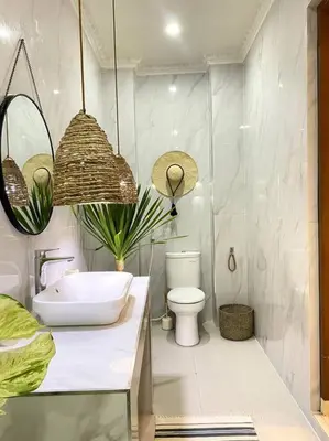 a bathroom with a sink and a toilet at Cozy 3 Bedroom Villa in Seminyak in Seminyak