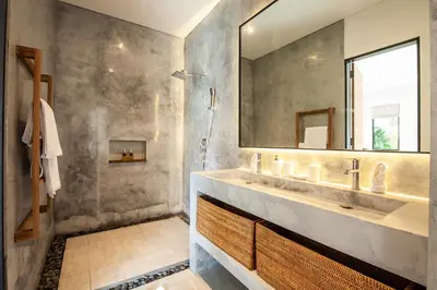 a bathroom with a sink and a mirror at Zayana Villas Resort Seminyak in Seminyak
