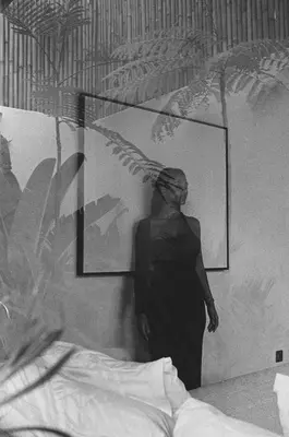 a person standing in a room with a picture on the wall at Designer 3BR Villa Tropical Stay Near Canggu in Kerobokan