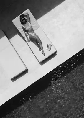 a picture of a woman on a table next to water at Designer 3BR Villa Tropical Stay Near Canggu in Kerobokan