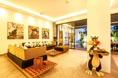 a living room with a couch and a table at Splendid Villa 3Br 200m to the Brawah beach in Canggu