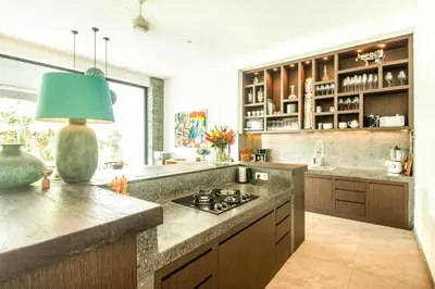 a kitchen with a counter with a stove in it at Splendid Villa 3Br 200m to the Brawah beach in Canggu