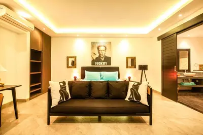 a living room with a couch and a bed at Splendid Villa 3Br 200m to the Brawah beach in Canggu