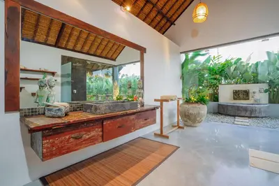 a bathroom with a double sink and a large window at Villa Elyse Seminyak in Seminyak