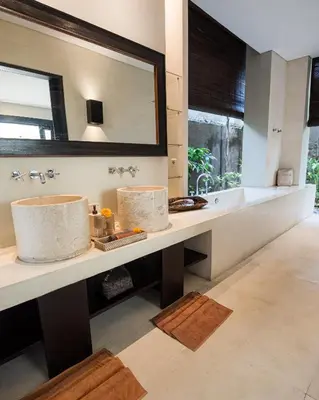 a bathroom with two sinks and a large mirror at Villa Spirit 4 BR - Canggu in Canggu