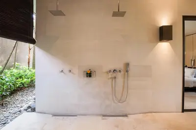 a bathroom with a shower in a wall at Villa Spirit 4 BR - Canggu in Canggu