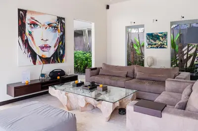 a living room with a couch and a coffee table at Villa Spirit 4 BR - Canggu in Canggu
