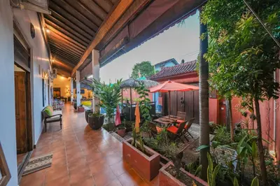 an indoor courtyard of a house with plants at Huge 2 Bedroom private pool Villa - Gong Zhu Camille in Pesanggaran