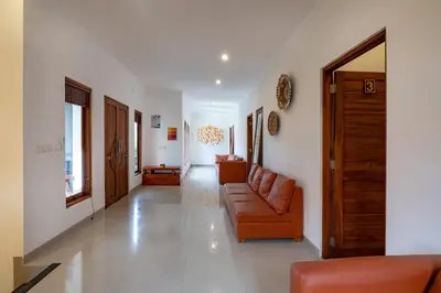 a living room with a couch and a chair at Vast 5bd Villa with Garden and Private Pool 250m to Beach in Seminyak