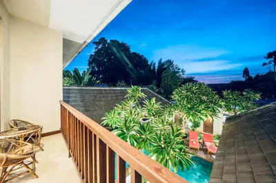a balcony with a view of a resort at Villa Olli in Seminyak