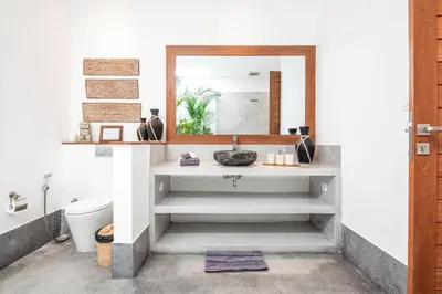 a bathroom with a sink and a mirror at Luxurious 6 Br in Canggu 400m to Finns Beach in Canggu