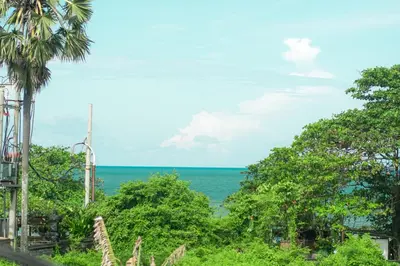 a view of the ocean from a resort at Tropical Beach House Bali in Seminyak