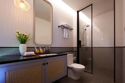 a bathroom with a toilet and a sink and a shower at New Luxury Villa Adamare 1 in Kerobokan