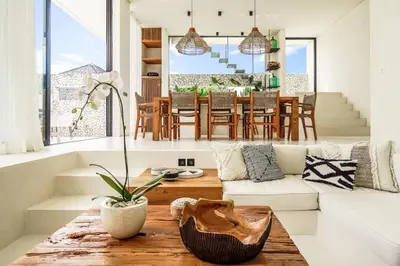 a living room with a couch and a table at Casa Umalas Villa by Betterplace in Canggu