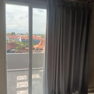 a window with a view of a roof at 9 Residence's Seminyak in Seminyak